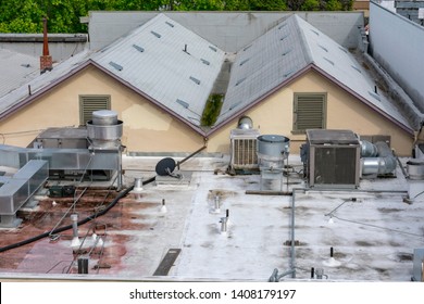 Air Conditioning Systems On Roof Of Commercial Buildings. The Rooftop Location Benefits From Less Noise Pollution, Minimize Dirt And Damage, Increased Security, Space Savings And Ease Of Maintenance