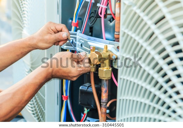 Air Conditioning Technician and A part of\
preparing to install new air conditioner.\
