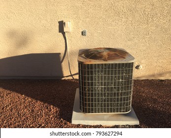 Air Conditioning Unit Machine Outside Stucco Red Rock Southwest Hot Heat Summer Bills Energy Conservation Use Electric Cool Heat Rusty Old New