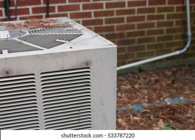 Air Conditioning Unit Outside Of Red Brick Building