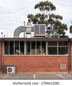 Air conditioning unit and a red brick commercial building
