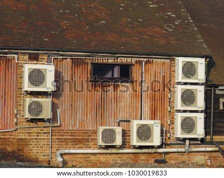  Air conditioning units on an old building                             