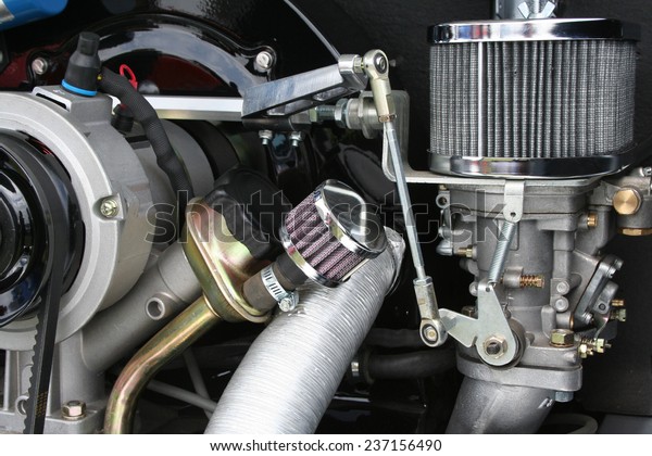Air cooled engine detail showing air filter,\
alternator carburetor and\
pulley.