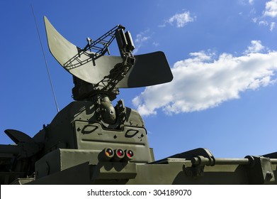 Air Defense Radar Of Military Mobile Mighty Rocket Launcher System Of Green Color, Modern Army Industry, White Cloud And Blue Sky On Background 