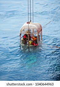 Air Divers Lowered Down By LARS In A Cage To Perform Subsea Work.