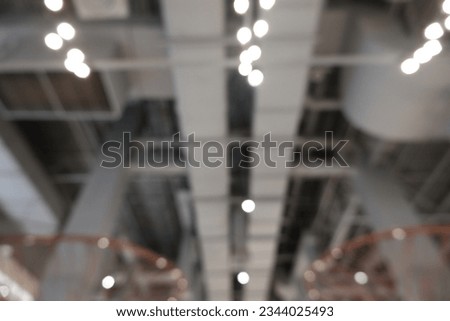 Air duct, wiring and plumbing in the mall. Air conditioner pipe, wiring pipe, and plumbing pipe system. Building interior concept. Ceiling lamp light with opened light. Interior architecture concept.