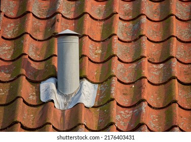 Air Flow Ventilation Pillar And Chimney On A Slate Roof Of Q House Or Factory Building Outside With Copyspace. Construction Of An Exterior Vent On Rooftop For Fireplace Or Oven Smoke And Heat Control