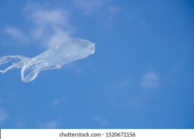 Air Flying Plastic Bag And Blue Sky.