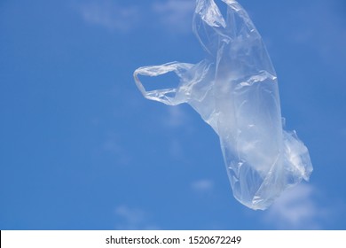 Air Flying Plastic Bag And Blue Sky.