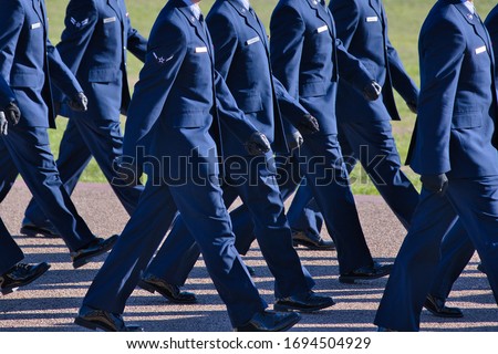 Air Force basic training graduation parade, new airmen marching.