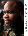 Air force combat control officer performing tactical level surveillance in command center. Headshot close up of military professional using radar systems to look at potential assault zones