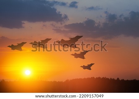 Air Force Day. Aaircraft silhouettes on background of sunset or sunrise.