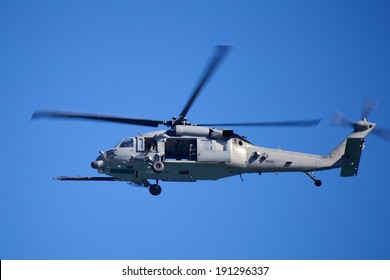 Air Force Helicopter Picture Of A US Air Force Helicopter Flying Over The Atlantic Ocean Against A Blue Sky.