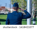 Air Force officer saluting at ceremony
