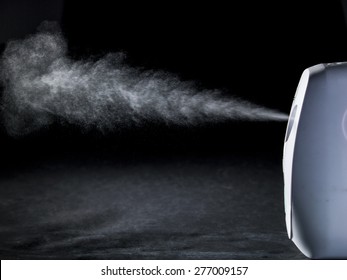 Air Freshener Spray In Front Of Black Background