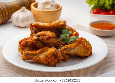 Air Fryer drummet chicken wing with Fish Sauce on white plate,less oil frying and crispy - Powered by Shutterstock