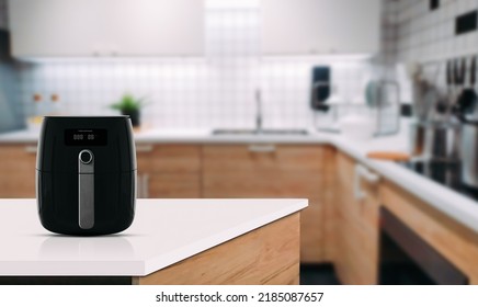 Air fryer machine cooking potato fried in kitchen. Lifestyle of new normal cooking. - Shutterstock ID 2185087657