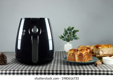 air fryer is on the table with grey wall background
 - Shutterstock ID 1980616733