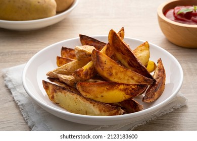 Air Fryer Roast Potatoes On White Plate With Potato Sauce