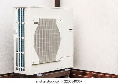 Air Heat Pump Beside House Wall