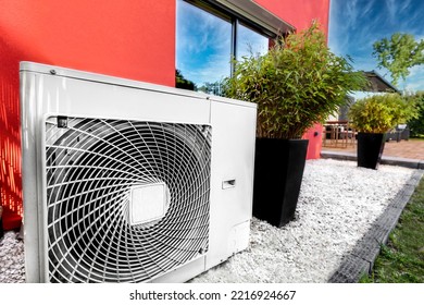 Air heat pump near modern house - Shutterstock ID 2216924667