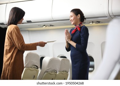 Air Hostess Or Stewardess Service , Young Slim And Atractive Woman Stewardess And Background Of Plane, Asian Flight Attendant Posing With Smile At Middle Of The Aisle Inside Aircraft Passenger Seat 