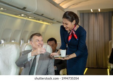 Air Hostess Takes Care Of Passengers In Planes,flight Attendants Serve On Board.