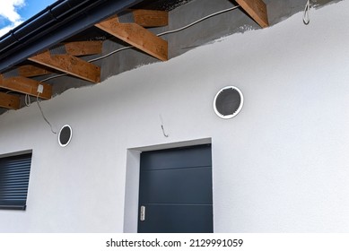 Air Intake And Exhaust In The Wall Of A Single Family House For Mechanical Ventilation With Heat Recovery, Secured With A Metal Grill With Mesh.