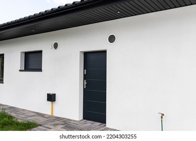 Air Intake And Exhaust In The Wall Of A Single Family House For Mechanical Ventilation With Heat Recovery, Secured With A Metal Grill With Mesh.