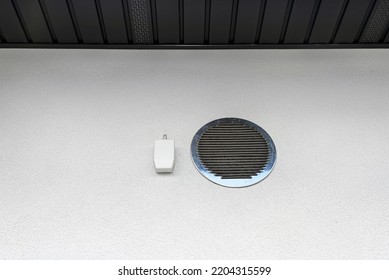 Air Intake And Exhaust In The Wall Of A Single Family House For Mechanical Ventilation With Heat Recovery, Secured With A Metal Grill With Mesh.