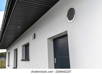 Air Intake And Exhaust In The Wall Of A Single Family House For Mechanical Ventilation With Heat Recovery, Secured With A Metal Grill With Mesh.