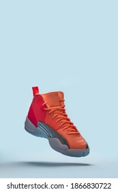 Air Jordan 12 Retro Flying Sneaker Isolated On The Blue Background