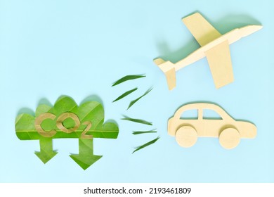 Air And Land Travel Or Transportation Industry Carbon Emission Reduction Concept. Airplane And Car Vehicle Releasing Low CO2 Icon Green Leaf Cutout.