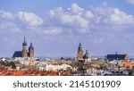 Air Panorama of Old Krakow with Basilica of St. Mary and Town Hall Tower on the Middle Ages Main Market Square of the City Sunny Day, Poland