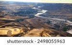 air photo of Lewiston Idaho and Clarkston Washington featuring the Clearwater River confluence with the Snake River, Potlatch Forest Industries plant and the inland ports.