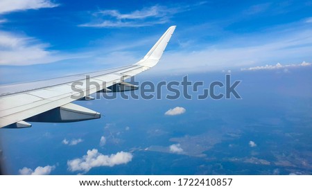 Air plane flying in a beatiful blue sky.