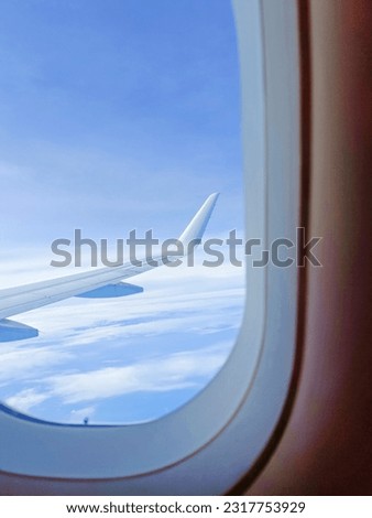 air plane wing tip at around 3000 feet above sea level