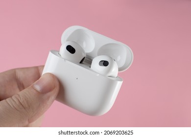 Air Pods 3. Air Pods 2021. with Wireless Charging Case. Magsafe. New Airpods on pink background. Airpods 3 .EarPods. 