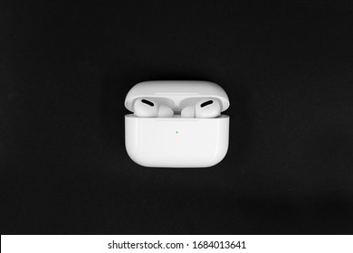 Air Pods Pro. with Wireless Charging Case. New Airpods pro on black background. Airpods Pro. Copy space - Shutterstock ID 1684013641