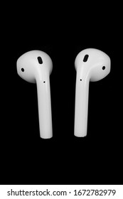 Air Pods. with Wireless Charging Case. New Airpods 2019 on black background. Airpods. macro.EarPods
