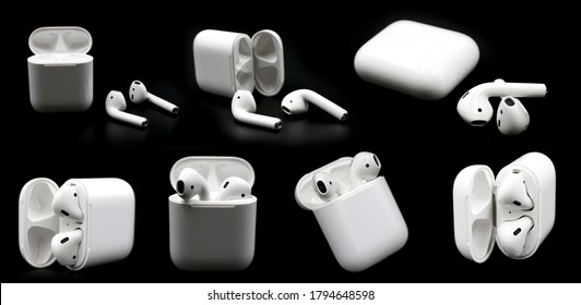 Air Pods. with Wireless Charging Case. New Airpods 2019 on black background. Airpods. EarPods.Airpods wireless headphones and case.