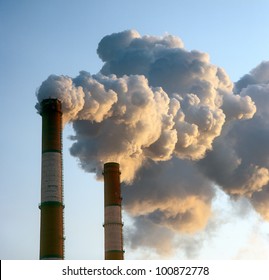 Air Pollution By Smoke Coming Out Of Two Factory Chimneys.