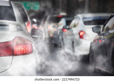 Air pollution from car exhaust smoke traffic in the city. Reducing global warming pollution and carbon dioxide from engine combustion. - Powered by Shutterstock