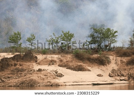 Air pollution caused by dry season agricultural and forest burning by the Mekong River, between Huay Xay and Pak Beng in Laos.