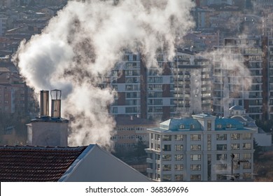 Air Pollution In City. Smoke Rising From Chimney