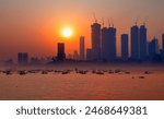 Air pollution concept - Modern highrise rich buildings and poor slums at sunset - Mumbai, india 