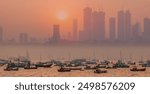 Air pollution concept - Modern highrise rich buildings and poor slums at sunset - Mumbai, india 