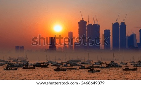 Air pollution concept - Modern highrise rich buildings and poor slums at sunset - Mumbai, india 