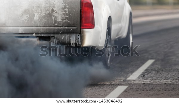 air pollution crisis in city from diesel vehicle
exhaust pipe on road
