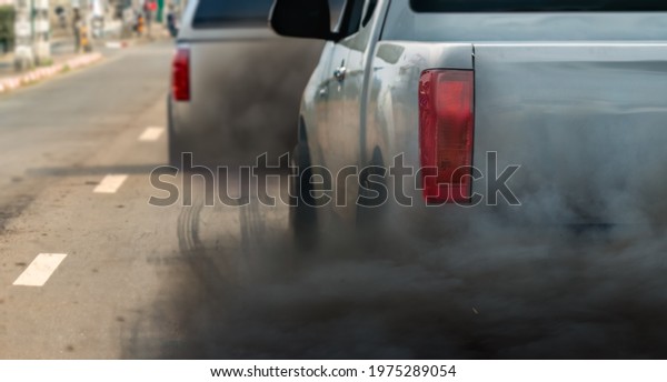 air pollution crisis in city from diesel vehicle\
exhaust pipe on road